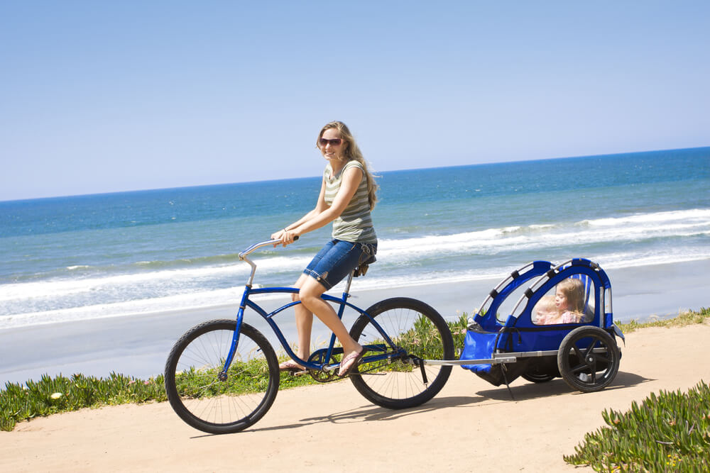 A woman riding around on a Kapaa bike rental.