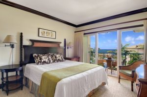 The bedroom of a Kauai vacation rental to relax in after going whale watching.