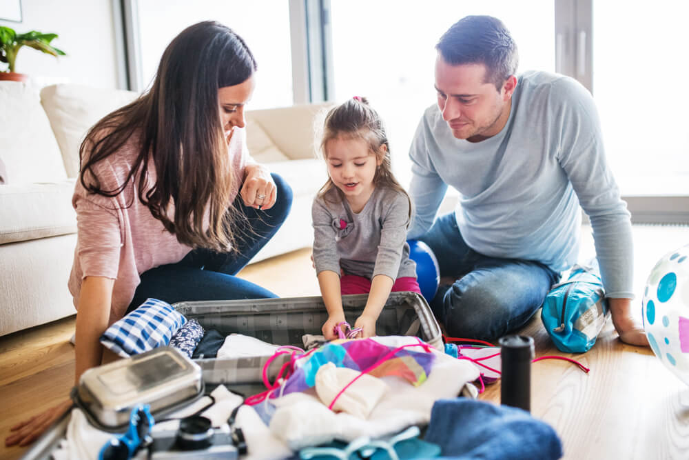 A family packing for one of their vacations to Kauai.