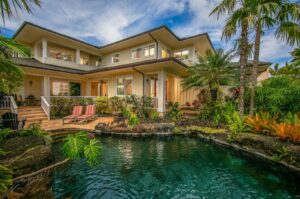 The pool of a Kauai vacation rental to relax in after exploring Old Koloa Town.