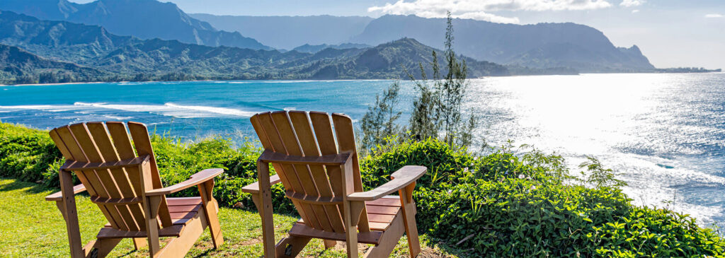 Summer in Hawaii Chairs overlooking the ocean, perfect for relaxing on a summer vacation in Kauai, Hawaii.