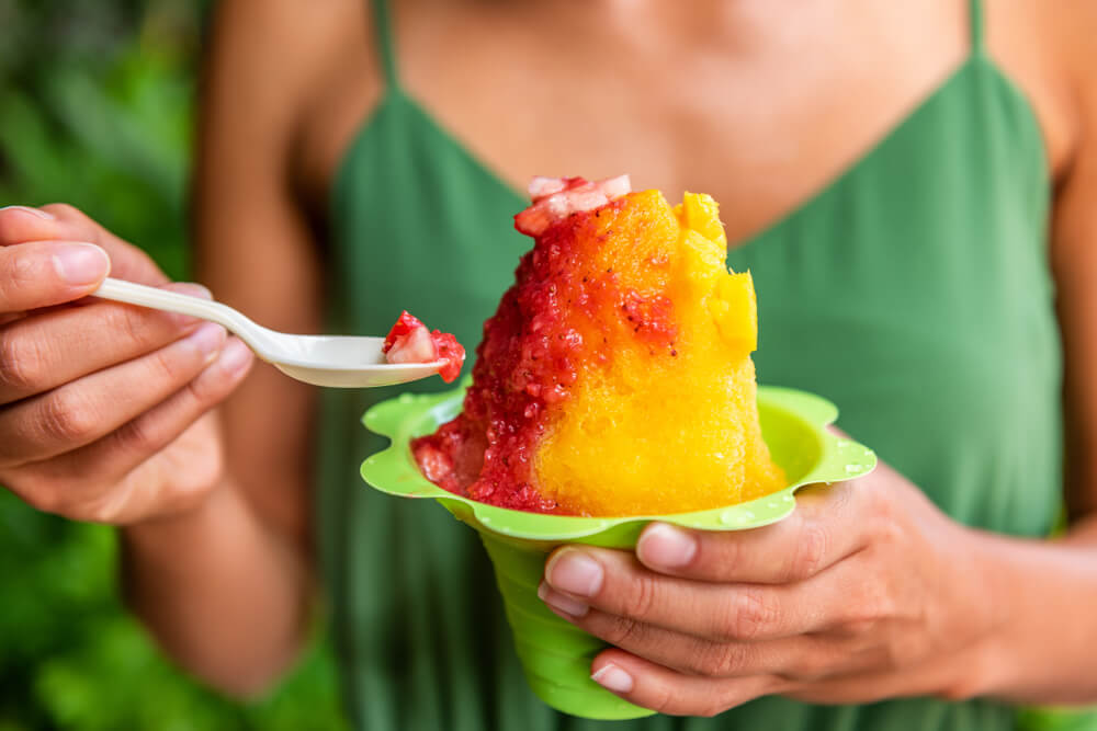 A person with shave ice on Kauai.