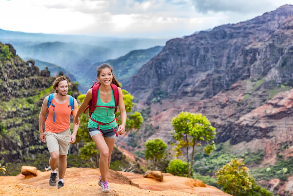 A couple hiking during the best time to visit Kauai.